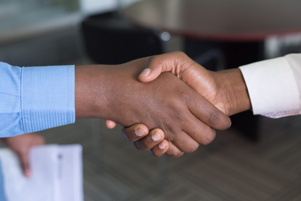 Shaking hands with business coach